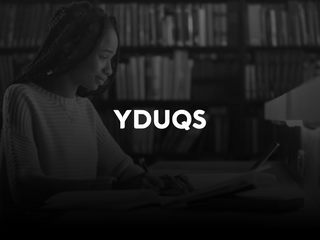 Black girls studying on her computer, at a library