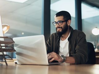 young man using a laptop 