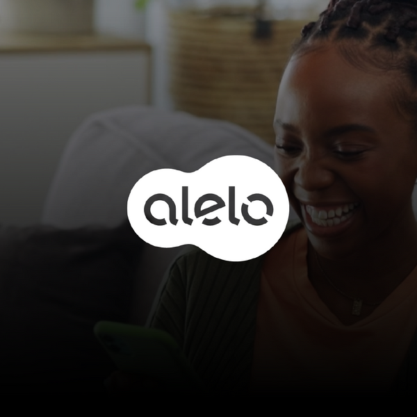 Alelo logo at the front of the image, and a black girl using her phone on the background.