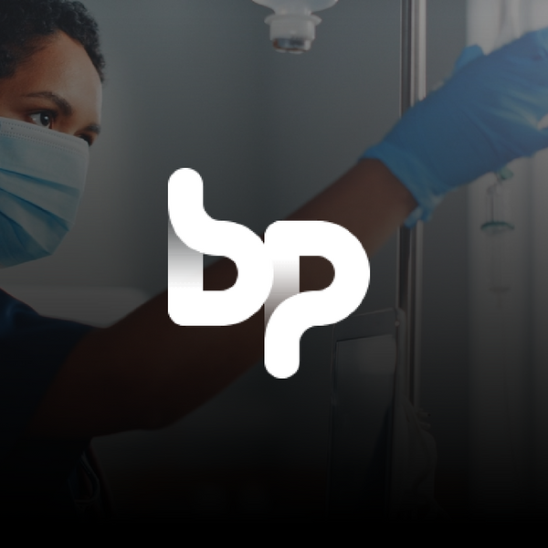 BP logo at the front of the image, and a black woman working at a hospital
