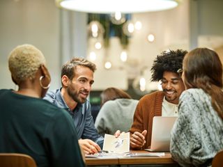 A group of professionals working together in an office setting.