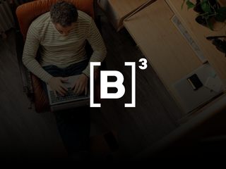 B3 logo, in white, and as background, an image of a man working on his laptop, sitting on a arm chair. 