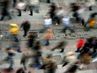 Elevated view of blurred motion people on busy street
