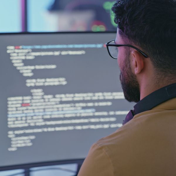 Computer coding, software development and programmer man writing code for cybersecurity analytics, seo data and digital cloud computing