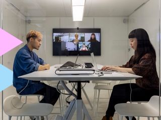 two business people working on their laptops