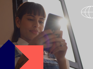 Young woman typing on the mobile phone