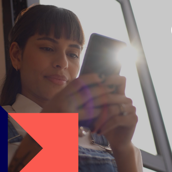 Young woman typing on the mobile phone