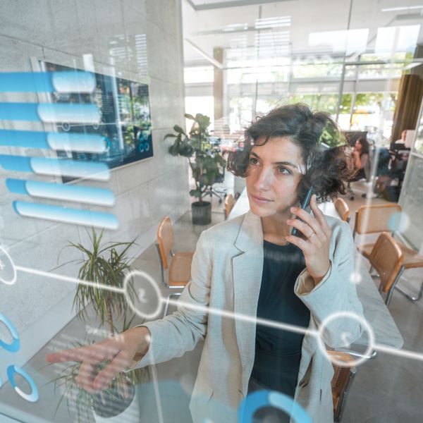 Woman looking at digital graph in front of her