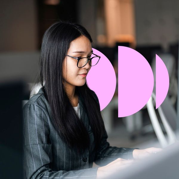Young asian woman working and doing a virtual business meeting on laptop at modern office.
