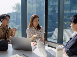 Team of coworkers talking in a business meeting