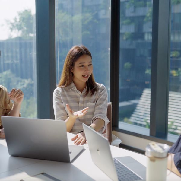 Team of coworkers talking in a business meeting