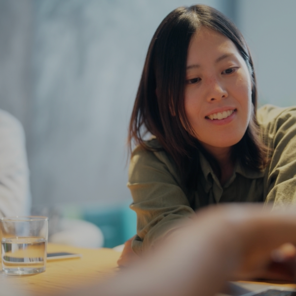 An Asian businesswoman is working on a laptop. 