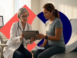 A female doctor and a patient reviewing health data on a tablet in a modern, sunlit medical office.