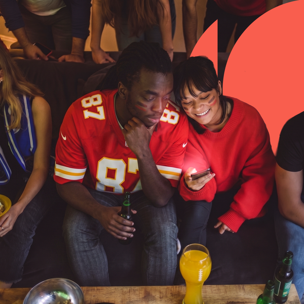 mixed group of young people watching a nfl game